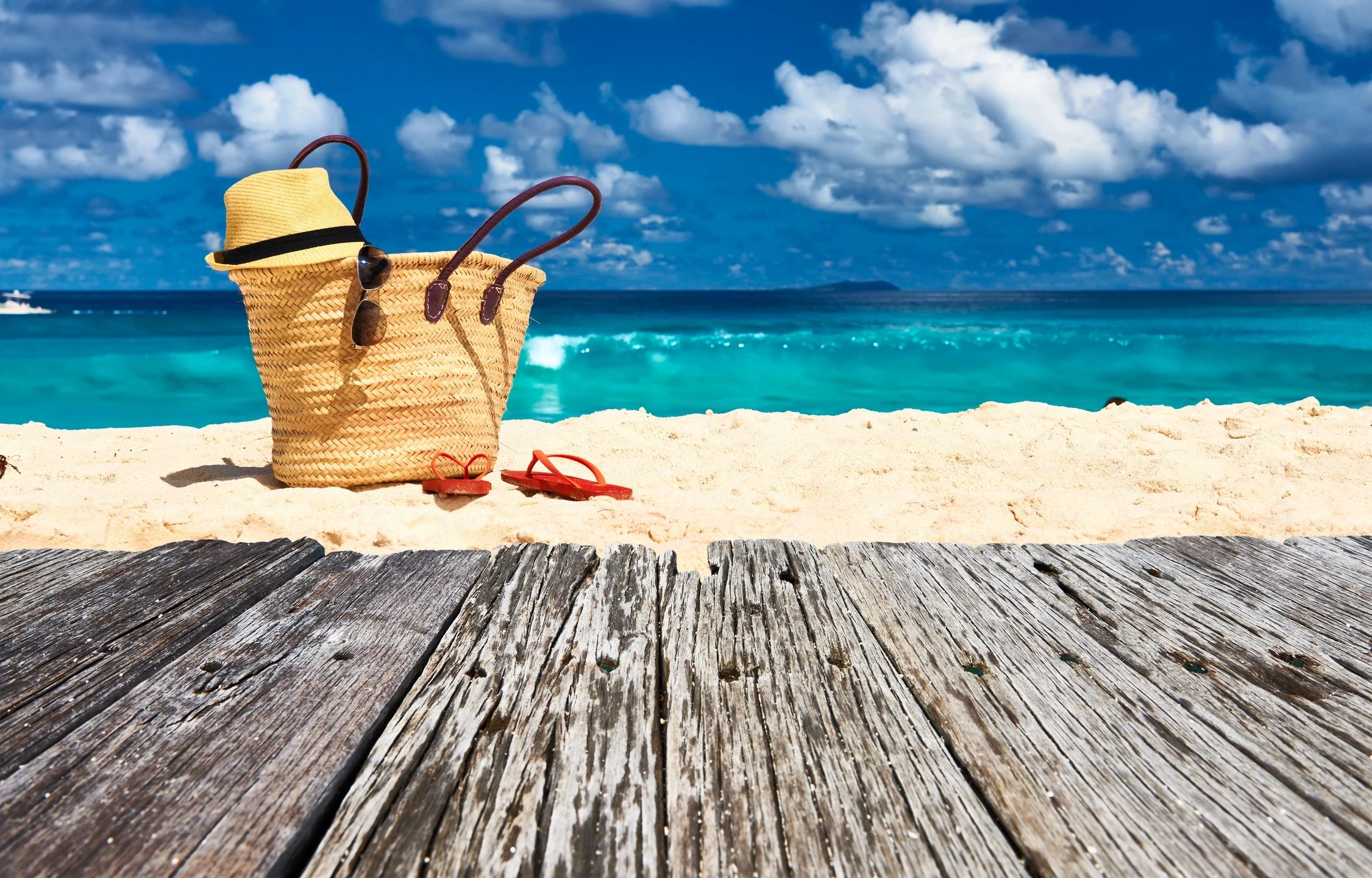 Straw hat beach bag sunglasses