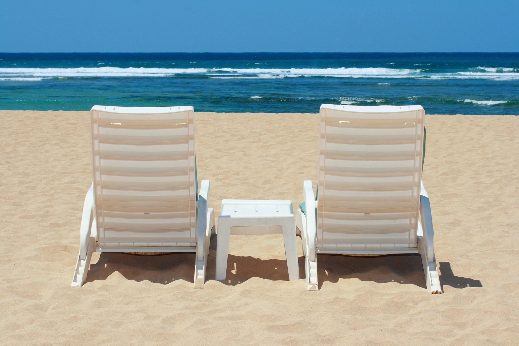 Beach lounge chairs ocean